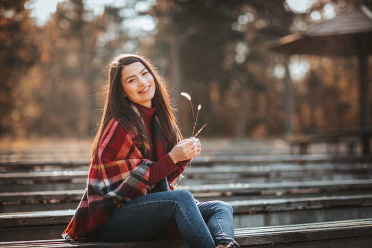 Fall into savings image - woman on a fall day